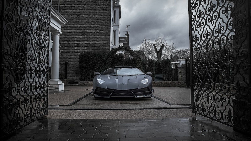 street, car, gates, building exterior, tree, built structure, architecture, motor vehicle, day, transportation, mode of transportation, no people, black