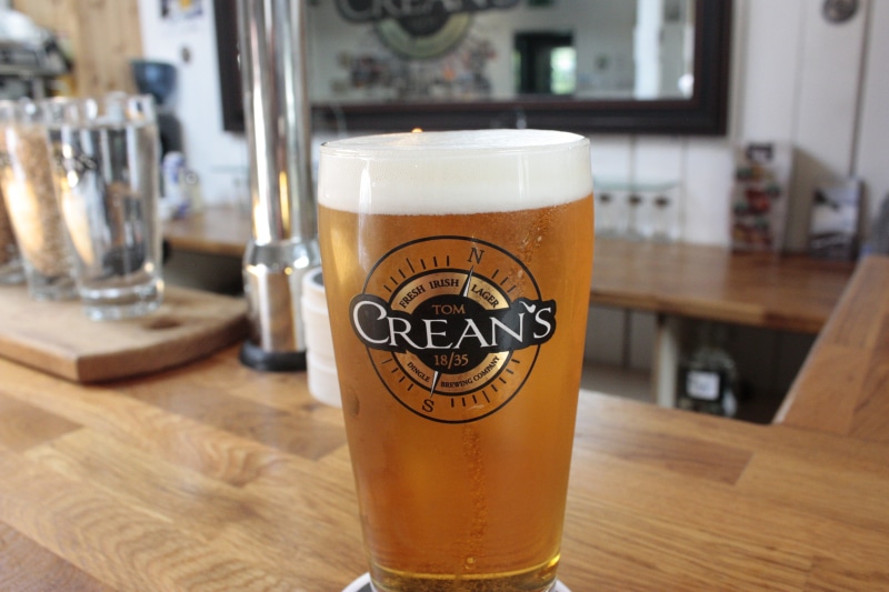 brewing, focus on foreground, dingle, stout, tom, bar counter, drink, crean, indoors, 4K, close-up, glass, refreshment, wood - material, pint glass, no people