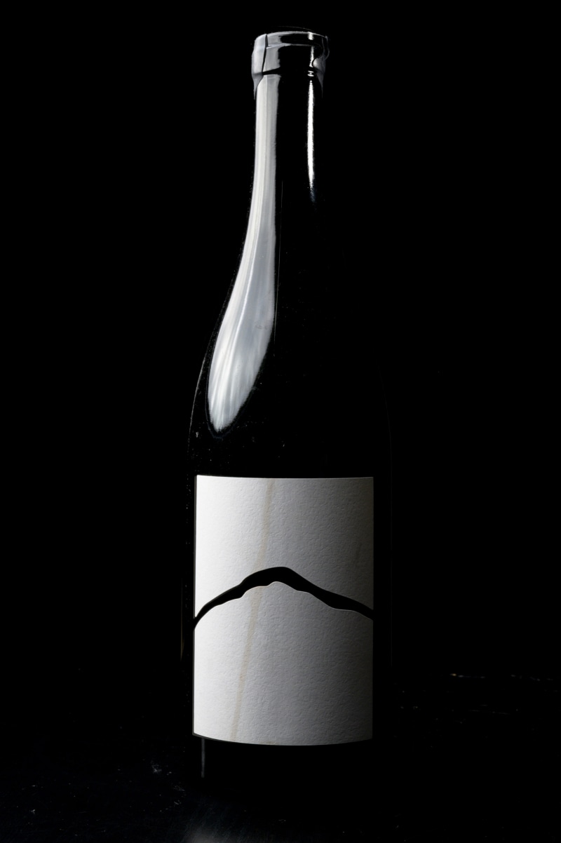 close-up, labeled, black background, dark, 5K, no people, cocktail, beer bottle, studio shot, transparent, freshness, bottle, glass, empty, lager, still life