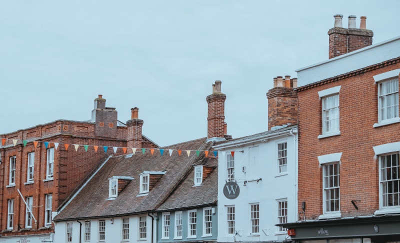 brown, brick, blue, white, bunting, hanging, facade, architecture, buildings, building exterior, communication, window, flaglet, brick wall, blue sky, multicolored