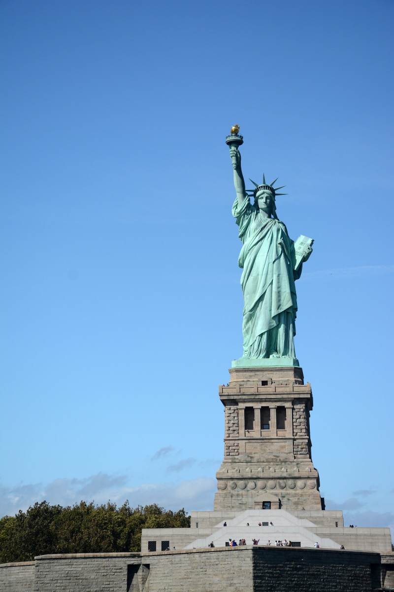 5K, clear sky, female likeness, statue, freedom, liberty, historic, no people, representation, flame, art and craft, low angle view, day, sculpture, sky