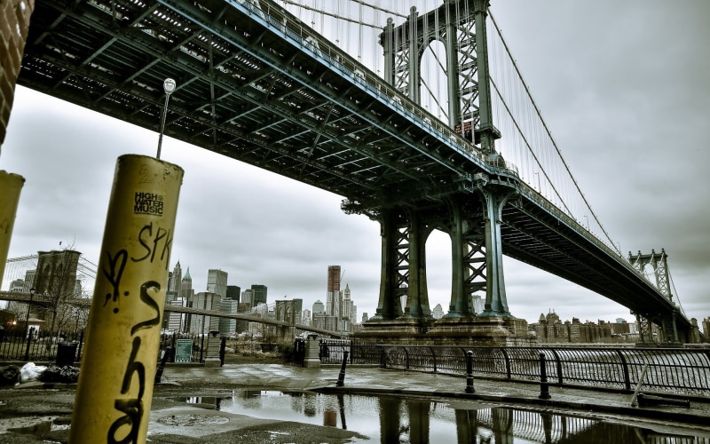 graffiti, sky, day, reflection, low angle view, city, building exterior, cityscape, tourism, travel destinations, Manhattan Bridge, skyscraper, engineering