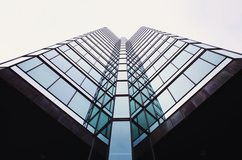 angle, directly below, tower, no people, facade, perspective, exterior, bottom, steel, gray, shape, skyscraper, alloy, lookup, reflection, clear sky, window