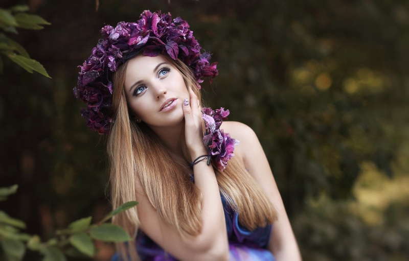 open mouth, women outdoors, nature, women, looking up, depth of field, blonde, model, blue eyes, wreaths, leaves, flowers, long hair, trees, 2K, bare shoulders