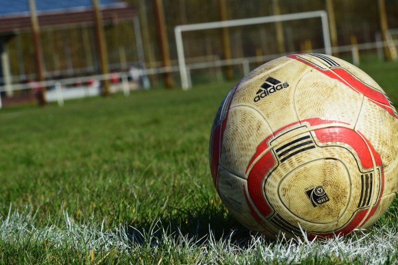 playing field, 5K, competition, focus on foreground, outdoors, ball, close-up, rush, playing, sports ground, soccer Ball, plant, soccer field, soccer