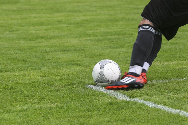 field, games, soccer-field, playing, kick, green color, human leg, sport, competition, hobbies, white, shoes, team sport, one person, soccer player, athlete