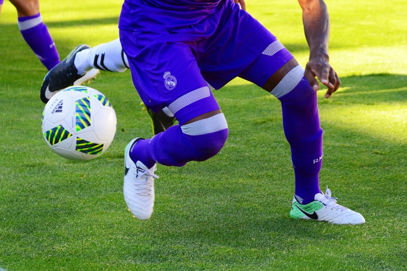 football, ball, soccer ball, boots, team sport, game, sport, soccer, soccer player, people, outdoors, soccer field, clothing, grass, goal, dribbling, team