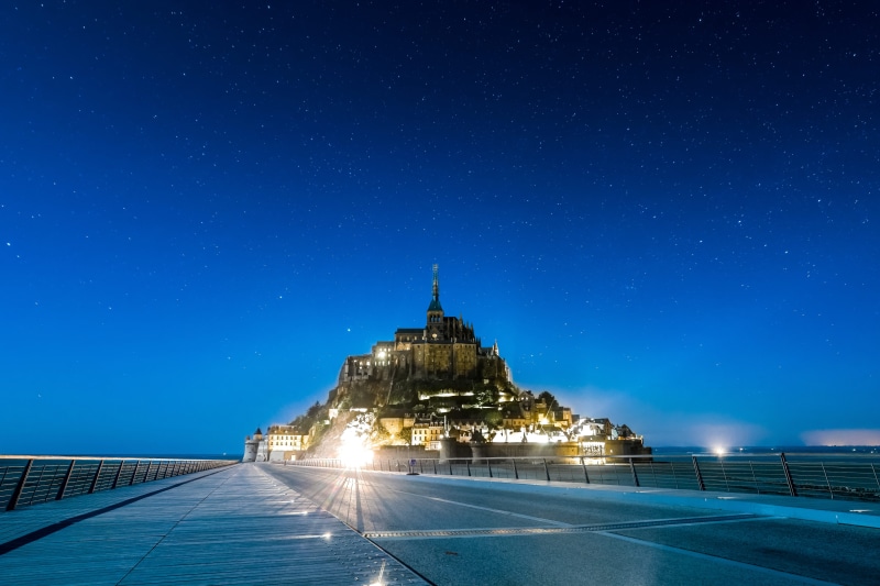coast, blue hour, building, saint, outdoors, night sky, mont saint michel, belief, city, church, spirituality, road, travel, mont, nighttime, no people