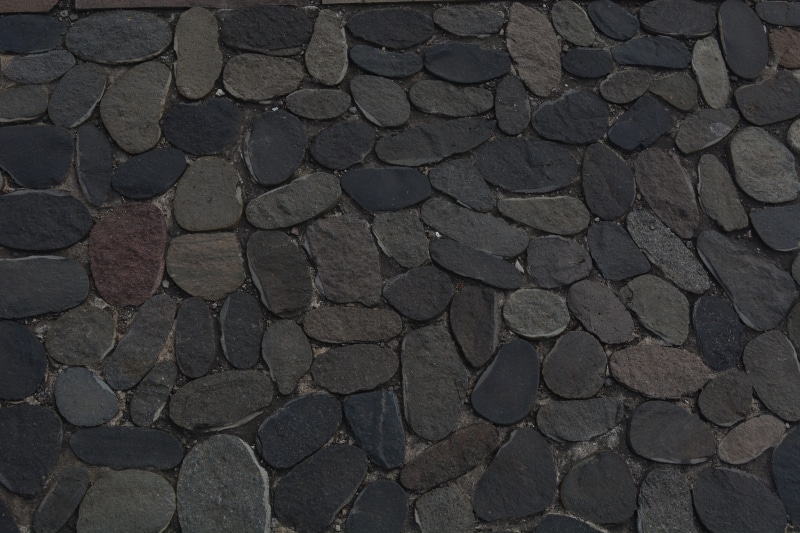 close-up, no people, solid, empedrado, outdoors, stone material, architecture, textured, built structure, street, river, 5K, grey, order, city, rock, backgrounds