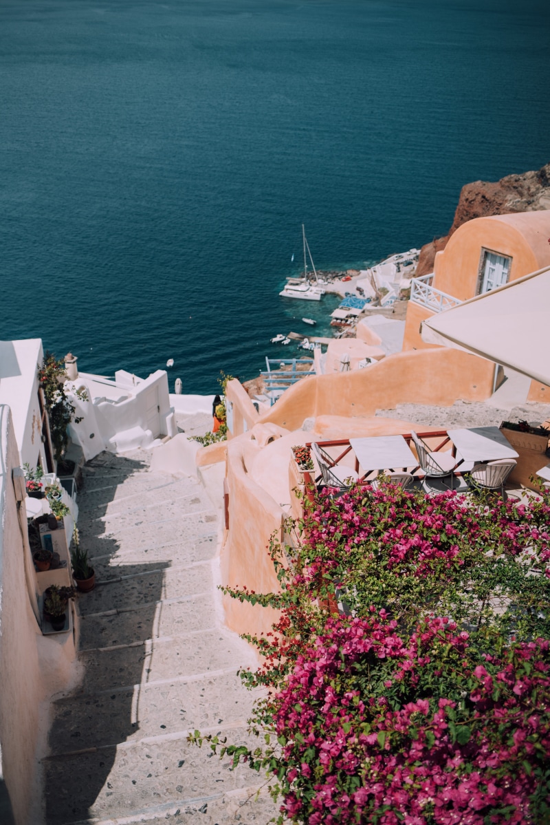 nature, wall, day, rock, blue, pink, freshness, built structure, santorini, green, transportation, coast, walkway, building exterior, cafe, brown, outdoors