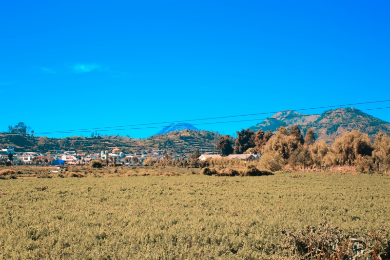 sky, non-urban scene, beauty in nature, blue, copy space, cloud, landscape, land, tranquility, indonesia, outdoors, rural scene, tranquil scene, environment