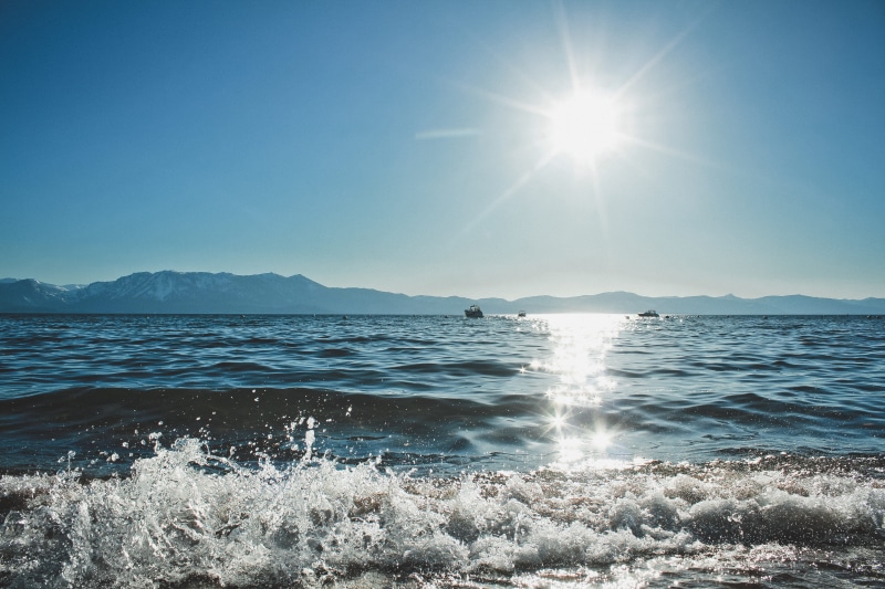 beach, dusk, sea, beauty in nature, 5K, bluesky, lens flare, bright, motion, nature, lake, sunlight, sunbeam, landscape, water, sun, hills, no people