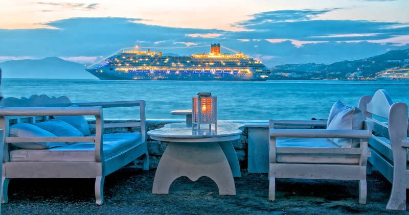 outdoors, two, ship, building, stay, lights, seat, sea, mountains, water, Mykonos island, white, restaurant, sky, table, cloud - sky, nature, Greece, dusk