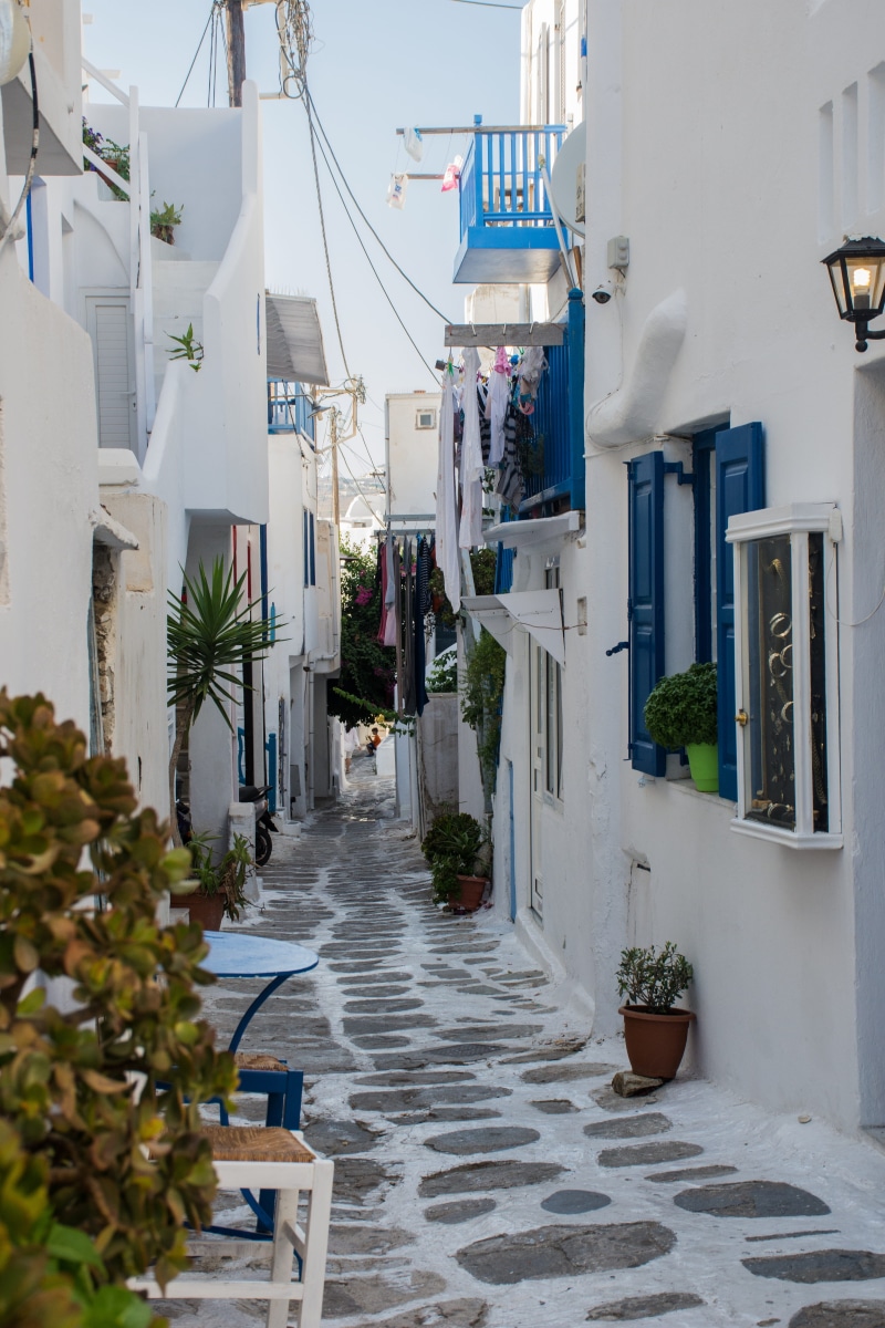 built structure, building exterior, narrow, architecture, people, white, shadows, blue, residential district, street, footpath, greek islands, tourism