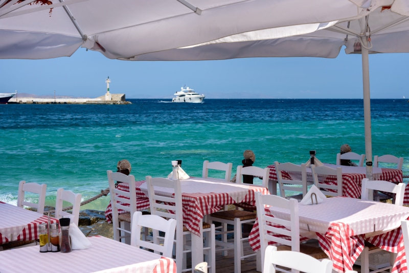 holiday, umbrella, 5K, trip, tavern, land, outdoor, sunny, dining, boat, mykonos, nautical vessel, no people, island, sunlight, horizon over water, tablecloth