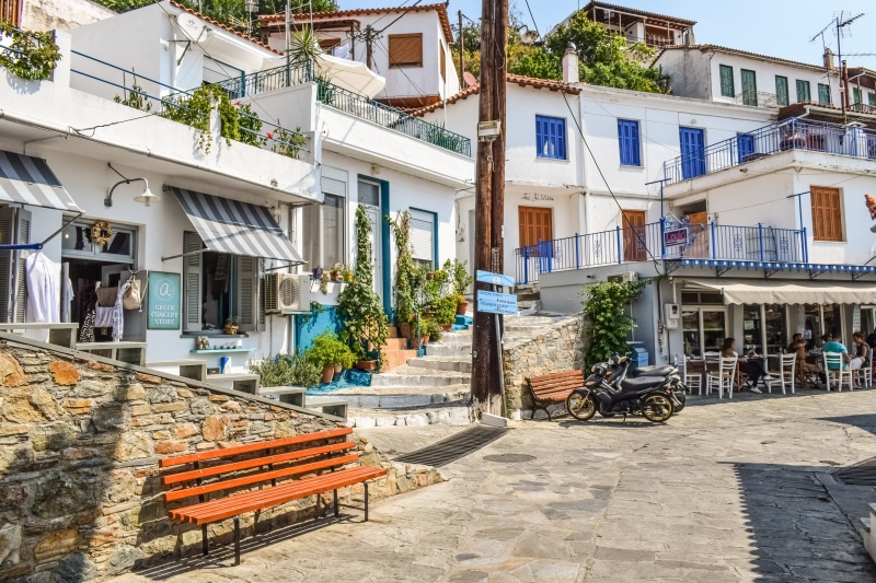 building, mediterranean, white, transportation, city, incidental people, square, built structure, houses, direction, seat, blue, street, building exterior