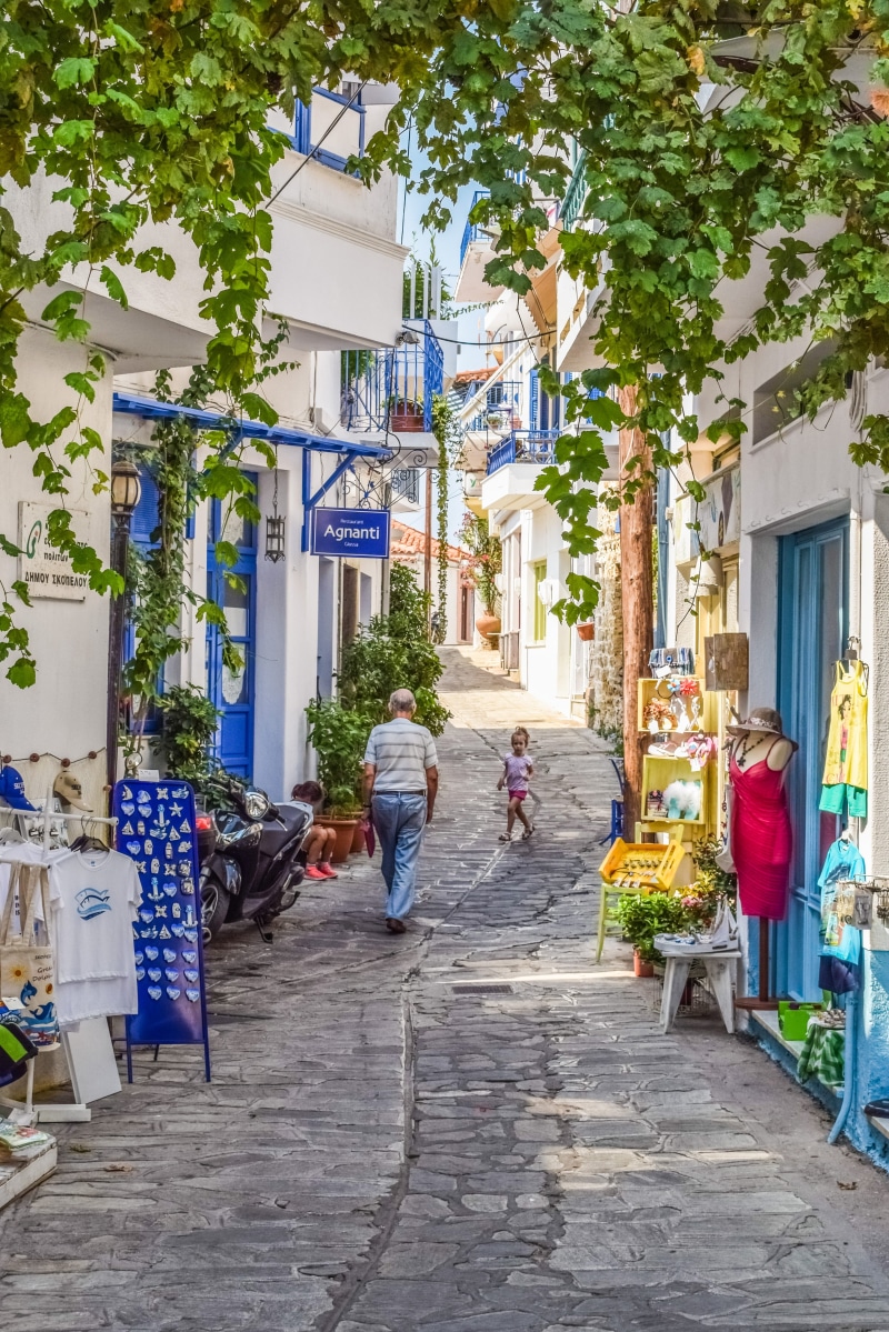 real people, footpath, building exterior, architecture, skopelos, building, man, sporades, greece, people, mediterranean, daytime, summer, village, leisure activity