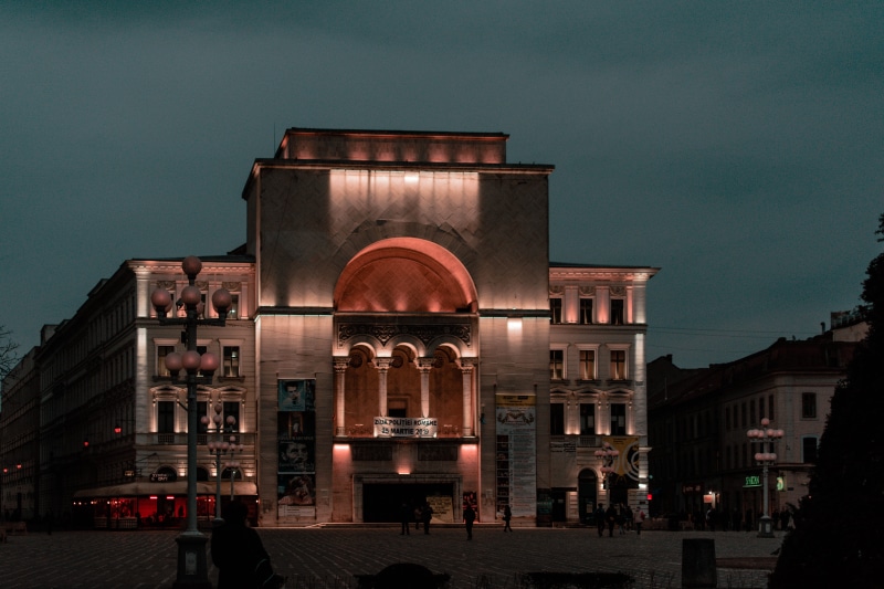person, romania, outdoors, building, facade, arch, human, travel destinations, monument, archi, shadows, urban, architecture, lights, city, timisoara, built structure
