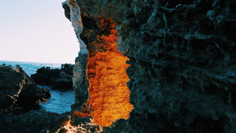 lighted, rock - object, sea, coast, 4K, daytime, water, scenics - nature, entrance, day, near, power in nature, eroded, body, outdoors, wizard, rock formation