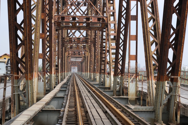 track, no people, metal, rail transportation, brown, day, direction, history, steel, bien, long, outdoors, public transportation, built structure, landscape