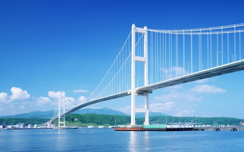 engineering, waterfront, outdoors, suspension bridge, bridge - man made structure, water, connection, travel, blue, transportation, built structure, sky