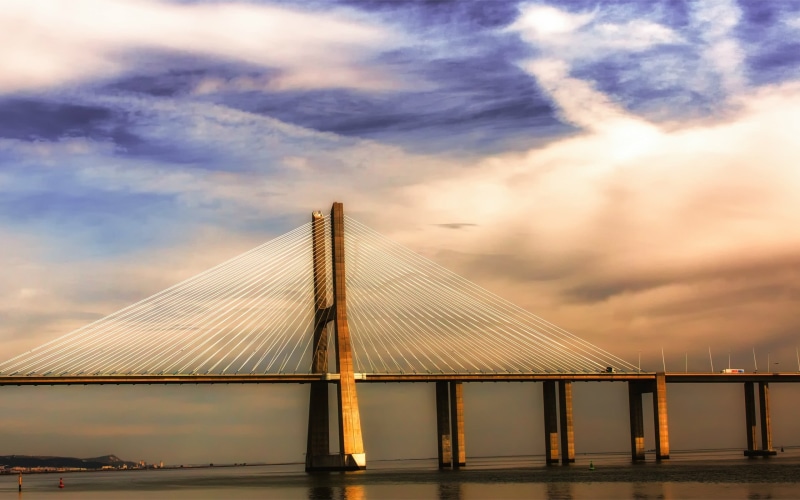 built structure, sunset, long, day, sky, cable-stayed bridge, architecture, water, low angle view, connection, concrete, bridge, outdoors, brown, bridge - man made structure