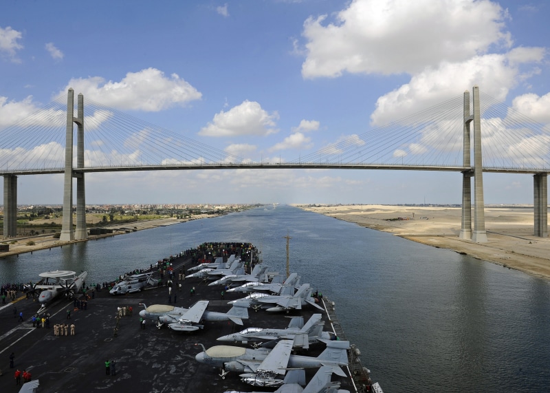 aerial, aircraft carrier, river, sky, fighter aircraft, canal, bay, architecture, cable-stayed bridge, travel destinations, outdoors, travel, nature, carrying