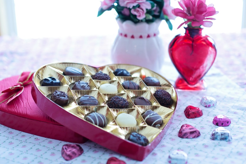 food, nature, holiday, still life, valentine, table, happy, plant, flowering plant, tablecloth, candy, chocolates, vase, food and drink, heart-shaped candy box