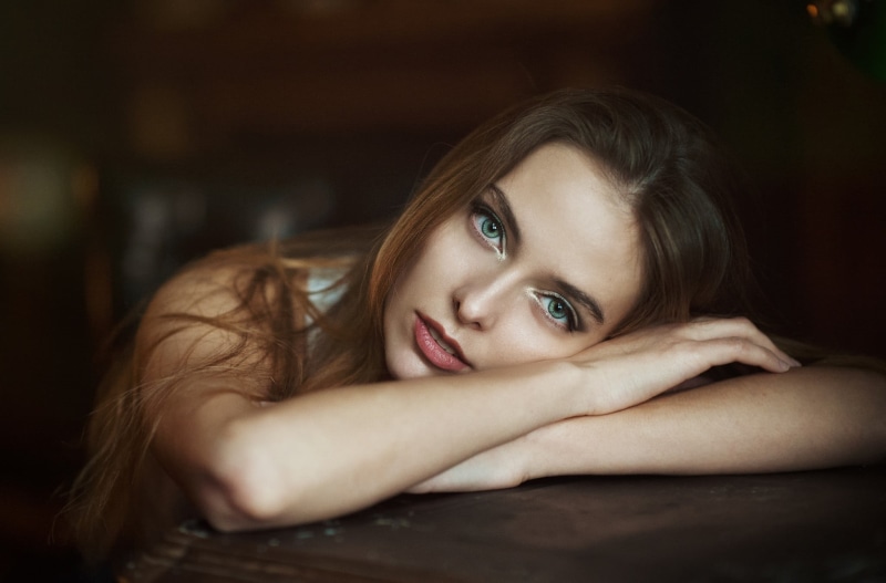 1080P, face, women, beautiful woman, lying down, adult, green eyes, beauty, headshot, hairstyle, relaxation, indoors, looking at camera, brown hair, hair