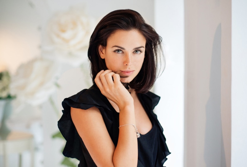 standing, brown hair, gray eyes, front view, beauty, one person, women, real people, Irina Antonenko, indoors, clothing, young adult, holding hair, 1080P