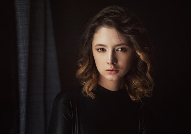 hair, Maxim Maximov, contemplation, face, one person, headshot, beautiful woman, brown hair, long hair, looking at camera, indoors, studio shot, curtain