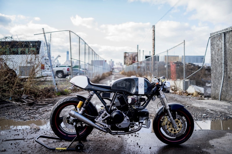 motorcycle, outdoors, land vehicle, abandoned, 1080P, Ducati, cloud - sky, Cafe Racer, road, damaged, no people, sky, city, stationary, built structure