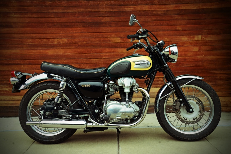 wall - building feature, yellow, w, bicycle, no people, old, retro styled, bike, parked, motorbike, wall, leather, land vehicle, standard, city, vinatge