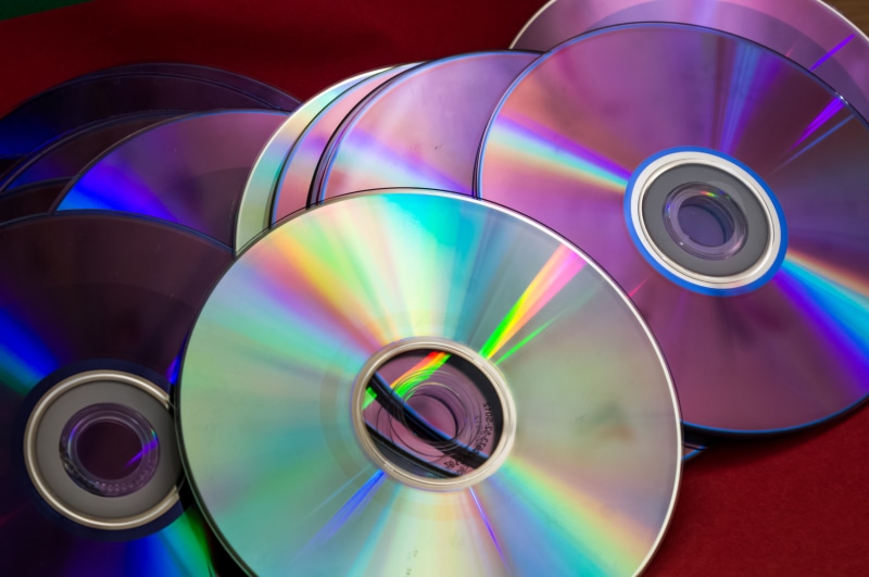 dvd, pattern, storage, studio shot, Device, label, purple, close-up, computer, large group of objects, directly above, no people, equipment, Computer, Disc