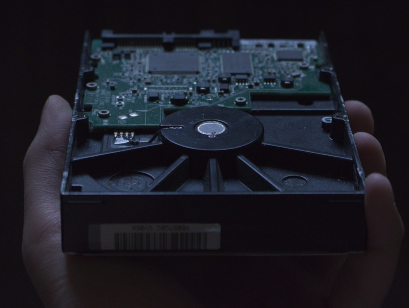 body part, human finger, equipment, finger, high angle view, hand, complexity, computer parts, personal perspective, connection, communication, hard disk