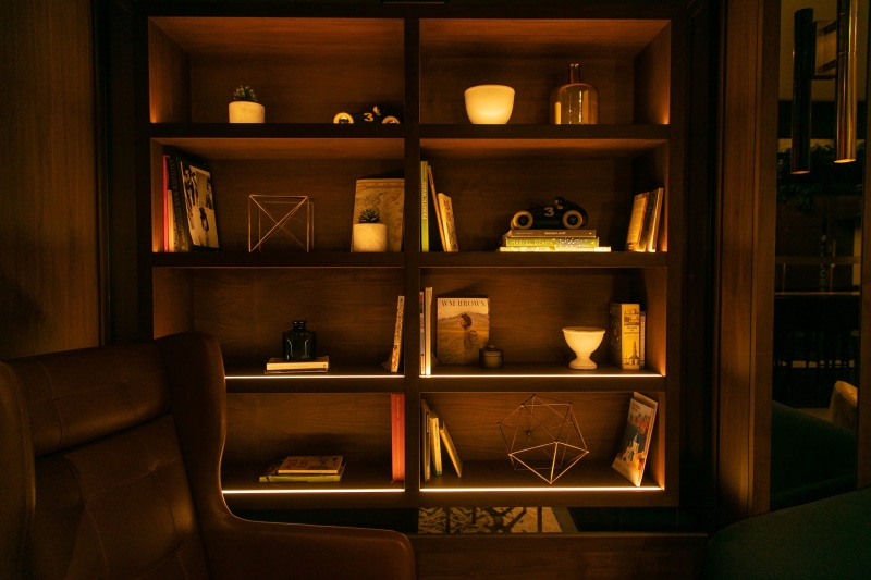 bookcase, cabinet, interior design, large group of objects, 2K, indoors, variation, couch, wood, arrangement, shelves, domestic room, shelf, closet, hardwood