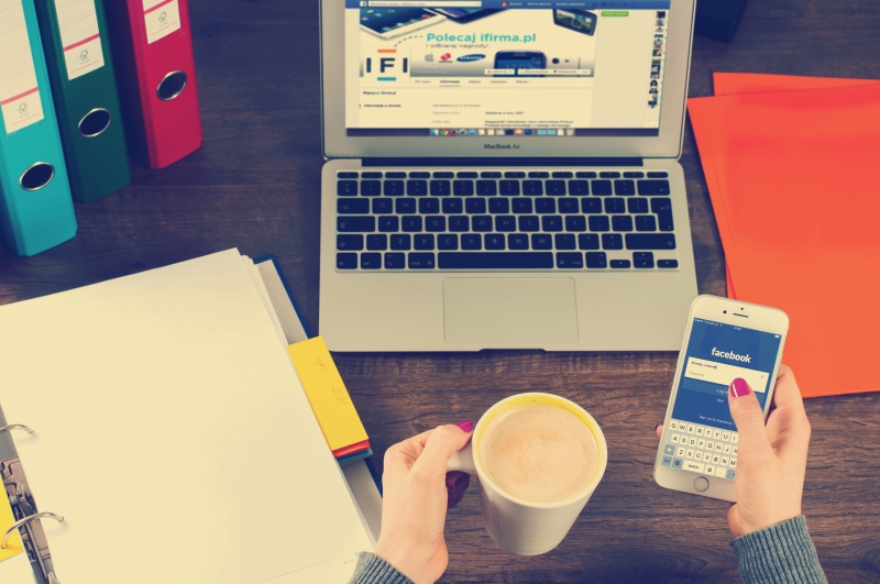 one person, facebook, hand, drink, corporate, high angle view, woman, coffee, document, paperwork, office, desk, contemporary, man, portable information device