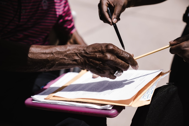 wear, paper, cooperation, hands, daylight, pen, indoors, clipboard, focus on foreground, person, human hand, real people, midsection, close-up, adult, hand
