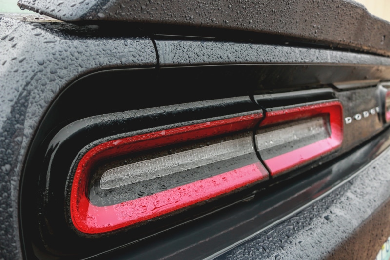 car, challenger, black color, no people, spoiler, wheel, mode of transportation, high angle view, transportation, reflection, taillights, vehicle, close-up