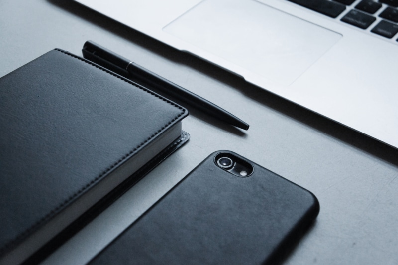 high angle view, beside, pc, indoors, laptop, label, mobile phone, paper, file binder, office, keyboard, computer keyboard, pen, computer, accessory, silver