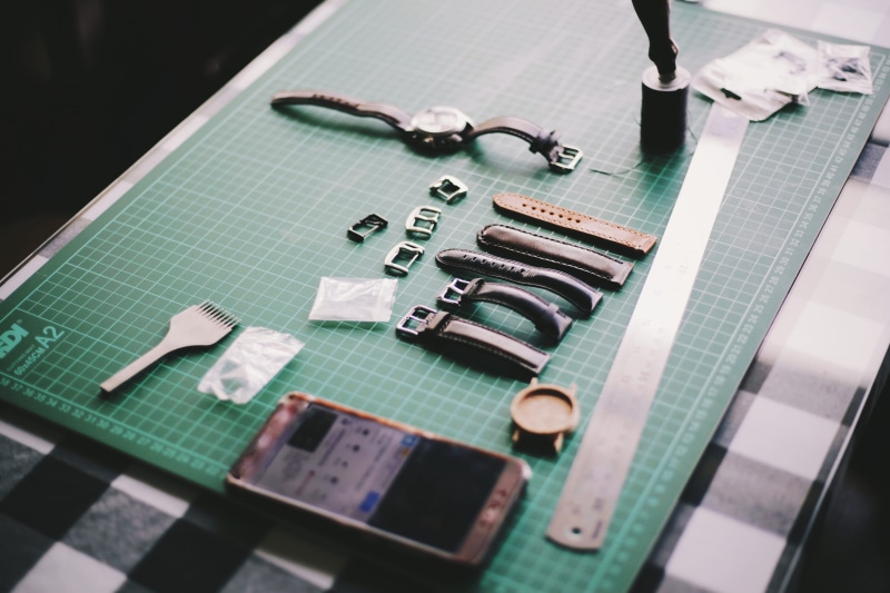 high angle view, watch, table, craft, leather, measure, technology, selective focus, science, straps, no people, ruler, music, time, wireless technology