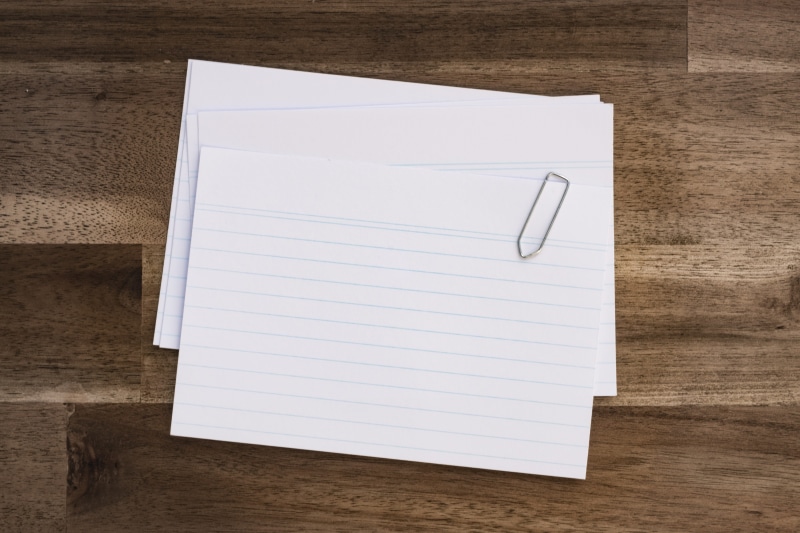 map, paperclip, reminder, paper, wood - material, blank, card, note pad, regulation, to do list, document, table, communication, white color, page, leave