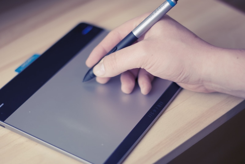 point, adults only, adult, people, indoors, hand, desk, connection, communication, human body part, writing, person, office, tablet, finger, one woman only