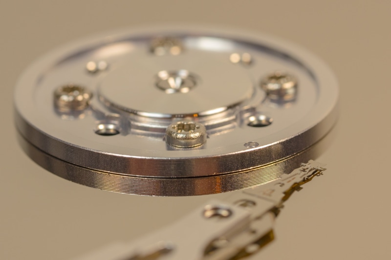 silver colored, magnetic data storage, indoors, colored background, data store, magnetic heads, time, no people, close-up, selective focus, data, detail