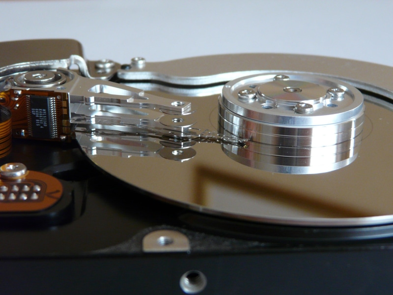 no people, computer, close, reflection, silver colored, read heads, science, harddisk open, indoors, close-up, electrical equipment, equipment, hdd, high angle view