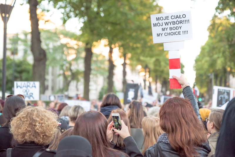 real people, polish, group of people, 2K, czarny, black monday, outdoors, holding, men, sign, news, placard, activists, activist, city, togetherness, czarnyprotest