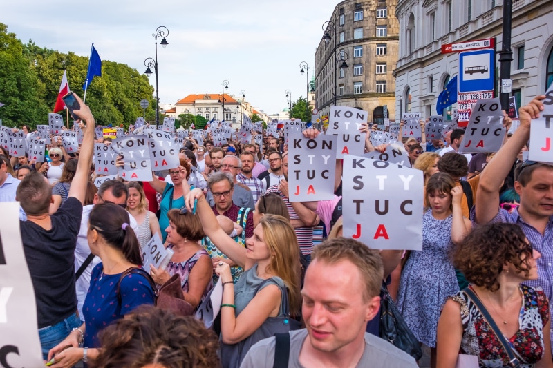 lifestyles, celebration, outdoors, 2K, men, arms raised, human arm, poster, arts culture and entertainment, dom, street, built structure, protest, politics