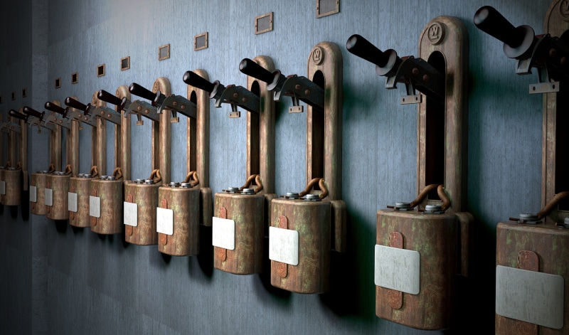 wall - building feature, lever, steel, in a row, metal, group, old, hanging, indoors, work tool, rear derailleur, large group of objects, hand tool, group of objects