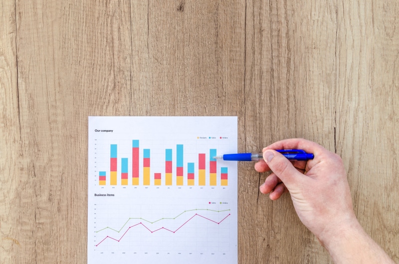 5K, multi colored, wood - material, data, human hand, human body part, analyzing, body part, table, bar graph, contemplation, people, adult, hand, graph