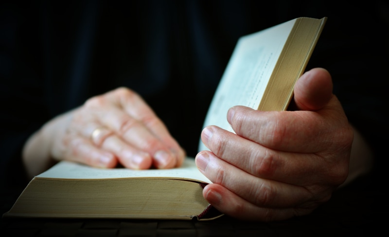 unrecognizable person, hand, indoors, holding, opening, open book, human body part, reading, learn, browse, 5K, education, hands, study, book, adult, wood - material